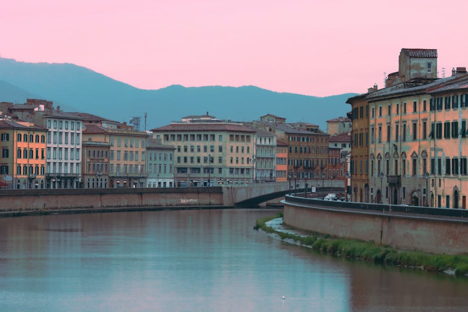 Pisa couple photographer Arno river golden hour